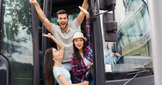 passengers happily boarding a bus